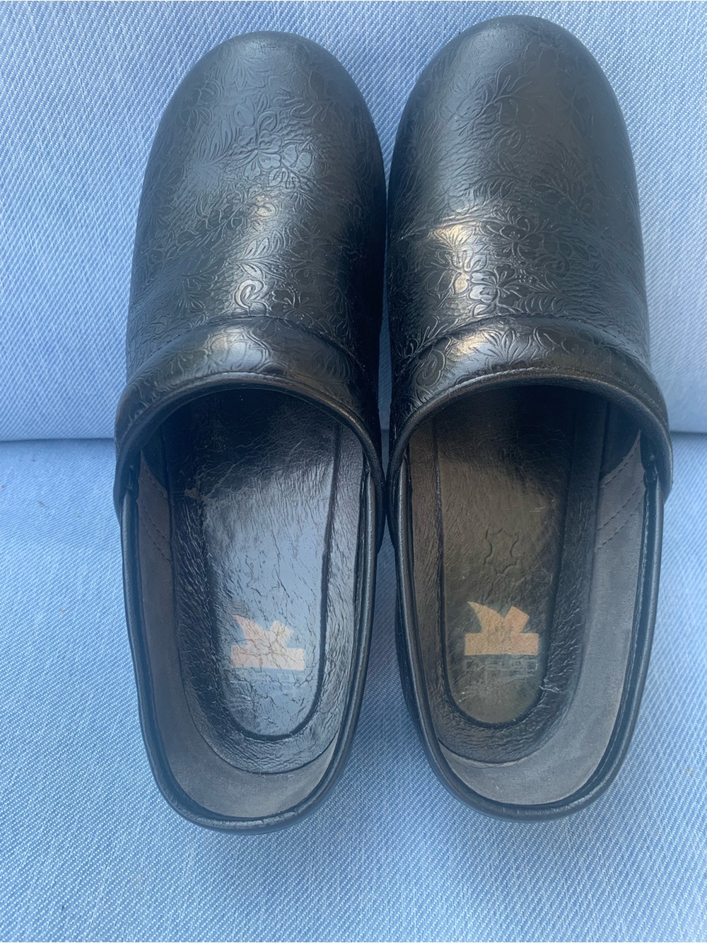 Women’s Dansko Black Slip-On Work Clogs with Subtle Floral Embossing